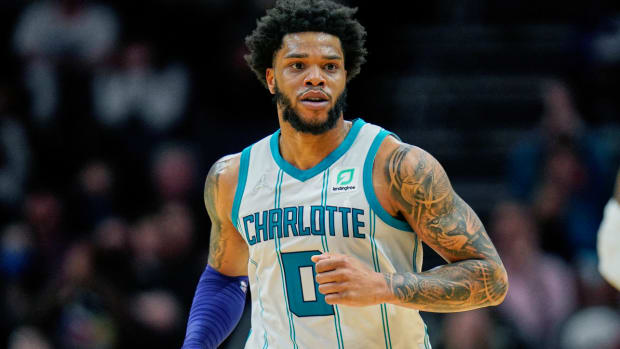 FILE - Charlotte Hornets forward Miles Bridges (0) moves up court during an NBA basketball game against the Denver Nuggets on Monday, March 28, 2022, in Charlotte, N.C. Hornets forward Miles Bridges was arrested Wednesday, June 29, 2022, in Los Angeles after a warrant was issued, according to the Los Angeles Police Department. The details of the arrest and the charges were not immediately available. (AP Photo/Rusty Jones, File)